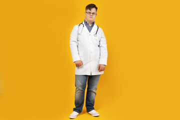 A boy with Down syndrome in a doctor's uniform