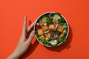 Fried tofu salad in a bowl, top view