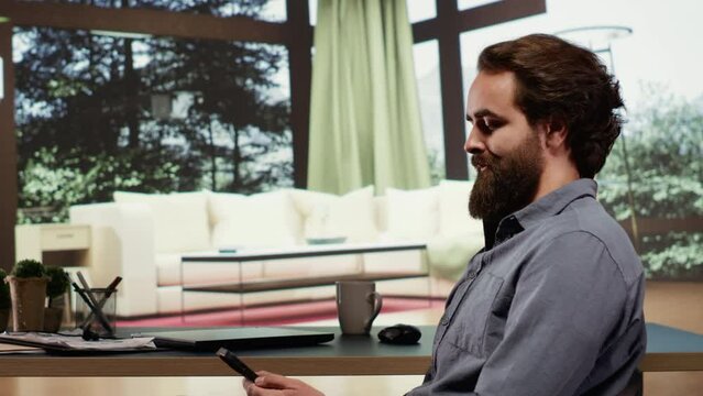 Successful billionaire sitting at his desk in luxury forest villa, relaxed rich person investing money in business. Wealthy person living in a modern cabin in the mountains, browses internet.