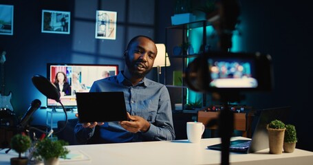 Content creator filming review of newly launched tablet, unboxing it and presenting specifications...