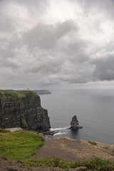 cliff landscape with gray skies and storm clouds. Cliffs in Ireland. Cliffs of Moher