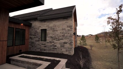 Front exterior panning reveal of a custom built home