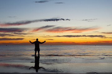 natural background man meets the sunrise on the sea
