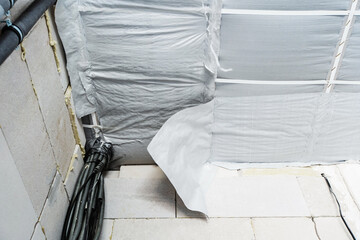 Ceiling covering with polypropylene fabric and thermal insulation materials. Repair and...