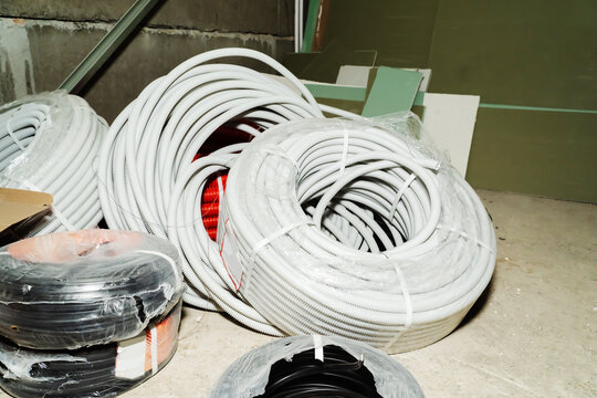 Polypropylene corrugation in rolls prepared for the installation of safe electrical wiring. Close-up