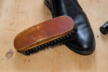 Waxing leather black classic shoes. Stock footage. 