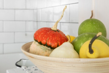 fruit and vegetable bowl, pumpkin and pears in the bowl, kitchen decor background