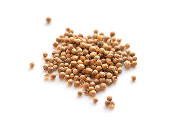 Pile of coriander seeds. Isolated on white.