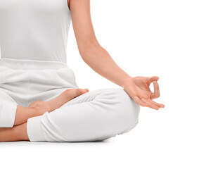 Fototapeta na wymiar Woman practicing yoga on white background, closeup. Lotus pose