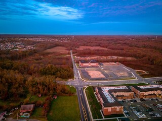 Scenic aerial view of Monroe, New Jersey cityscape at sunrise with a cloudy sky