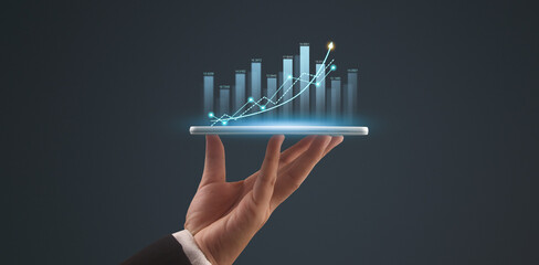 Businessman plan graph growth and increase of chart positive indicators,tablet in hand