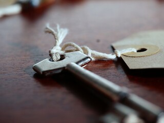 Old vintage key on wooden table