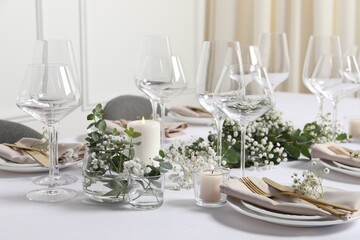 Beautiful table setting with floral decor indoors