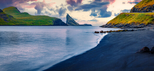 Dramatic summer scene of Faroe Islands and Tindholmur cliffs on background. Calm morning view of...