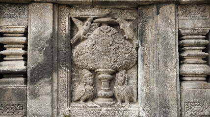Stone relief on the wall of Prambanan Temple. A Hindu temple located in Yogyakarta, Indonesia