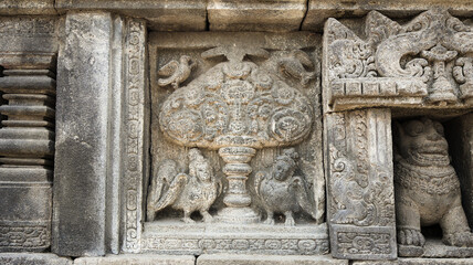 Stone relief on the wall of Prambanan Temple. A Hindu temple located in Yogyakarta, Indonesia