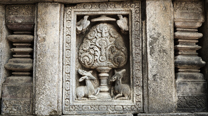 Fototapeta na wymiar Stone relief on the wall of Prambanan Temple. A Hindu temple located in Yogyakarta, Indonesia