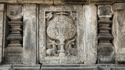 Stone relief on the wall of Prambanan Temple. A Hindu temple located in Yogyakarta, Indonesia