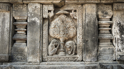 Stone relief on the wall of Prambanan Temple. A Hindu temple located in Yogyakarta, Indonesia