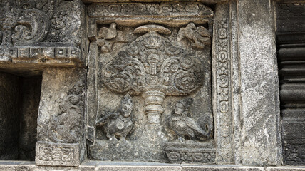 Stone relief on the wall of Prambanan Temple. A Hindu temple located in Yogyakarta, Indonesia