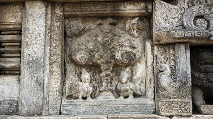 Stone relief on the wall of Prambanan Temple. A Hindu temple located in Yogyakarta, Indonesia