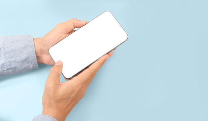 Obraz premium Hand holding smartphone device touching screen