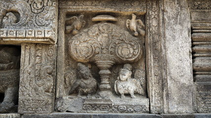 Stone relief on the wall of Prambanan Temple. A Hindu temple located in Yogyakarta, Indonesia
