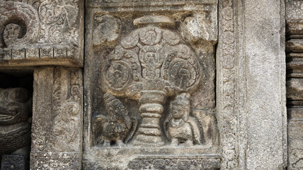 Stone relief on the wall of Prambanan Temple. A Hindu temple located in Yogyakarta, Indonesia