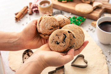 Homemade cookies in female hands, Christmas baking.