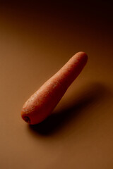 Carrot on a solid background dramatic lighting