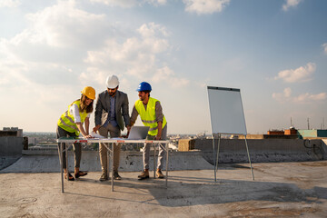 Team of architects people in group on construciton site check documents and business workflow