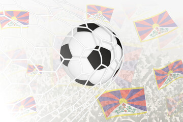 National Football team of Tibet scored goal. Ball in goal net, while football supporters are waving the Tibet flag in the background.