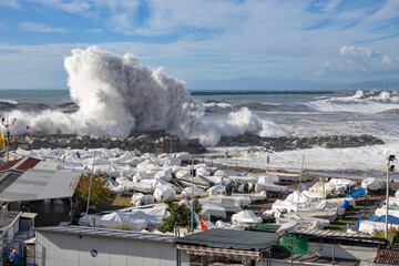 GENOA, ITALY, NOVEMBER 3, 2023 - Rough sea with big waves on the piers of the Genoa seafront, Italy