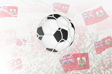 National Football team of Bermuda scored goal. Ball in goal net, while football supporters are waving the Bermuda flag in the background.