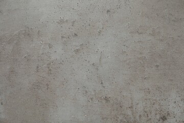 Texture of light grey stone surface as background, closeup