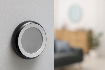 One thermostat on white wall indoors, space for text. Smart home system