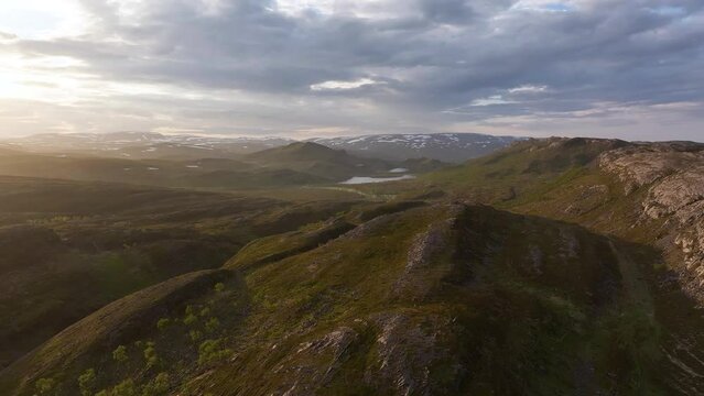 Midnight sun in a beautiful tundra landscape in Northern Norway in summer
