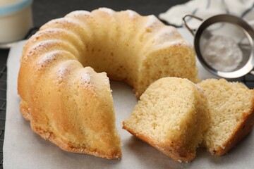 Delicious freshly baked sponge cake on table, closeup