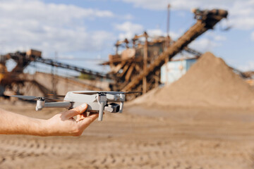 Industry drone working on open pit mine sand quarry or coal. Concept professional inspection of...