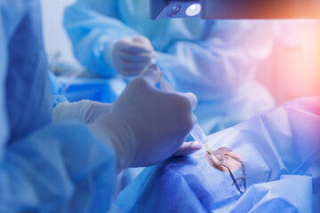 Process laser vision correction, lasik treatment. Doctor use equipment for fixing eyeball, patient...