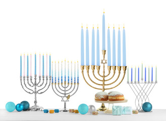 Hanukkah celebration. Composition with different menorahs, dreidels and gift boxes on table against white background