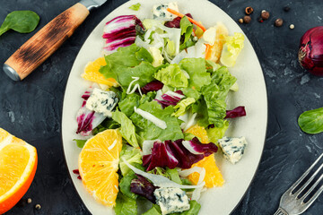 Salad with fresh greens and orange.