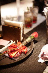 a single rose on the table is used to propose to a partner on valentine's day