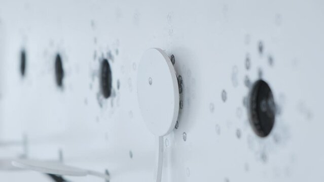 Hitting biathlon target at shooting range close-up. Winter sports. Shallow depth of field. Selective focus. Slow motion.