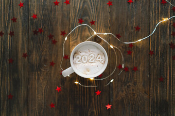 Happy New Year 2024 holidays drink, woman holding white coffee cup with number 2024. Christmas cup...