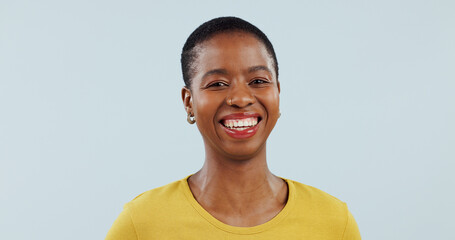 Happy black woman, portrait and face for career ambition or success isolated against a studio...