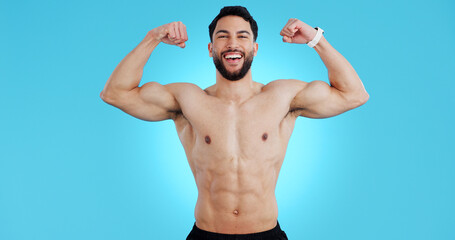 Happy man, portrait and muscle flex of bodybuilder in fitness isolated against a blue studio...