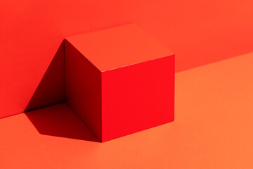 Red cube on red background