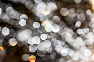 Water theme, abstract bokeh background of blurred out of focus plane water fountain droplets on...