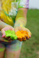 Holi colors on palms.